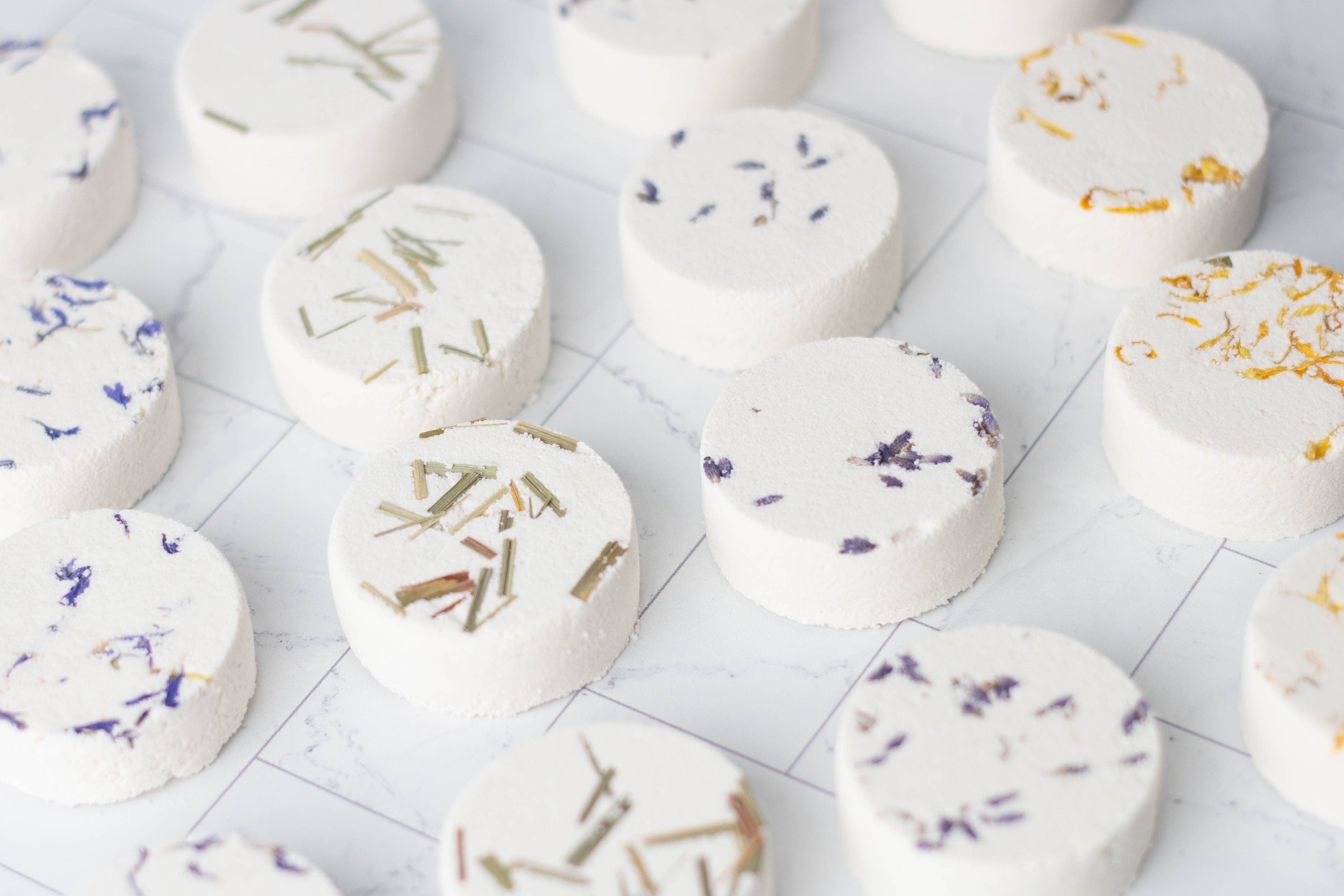 Aromatherapy shower steamer with essential oils. Biodegradable, handmade, and ultra-scented for a spa-like experience. Not for use as a bath bomb.