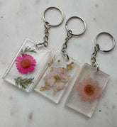These Resin Pressed Flowers Keychains are handcrafted with real dried flowers suspended in crystal-clear resin. 