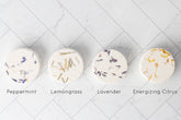 Aromatherapy shower steamer with essential oils. Biodegradable, handmade, and ultra-scented for a spa-like experience. Not for use as a bath bomb.