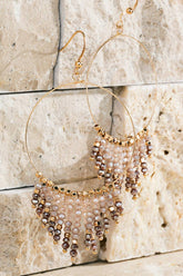Shimmering beaded tassel chandelier earrings with a lightweight metal ring, hypoallergenic fish hooks, and dazzling glass beads—perfect for any occasion! 