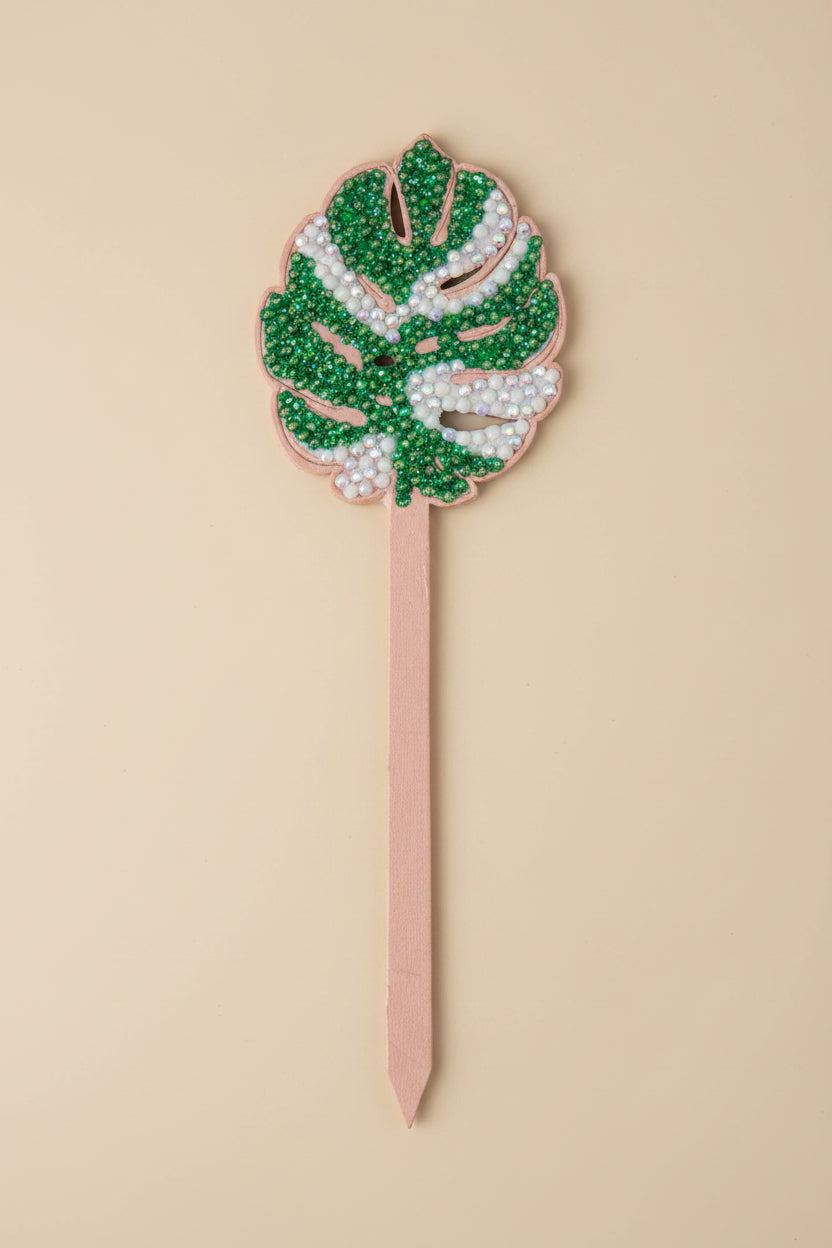 Bedazzled Monstera wooden plant stakes, hand-painted with sparkling details. Choose Monstera, Albo, Aurea or Thai Constellation for unique plant décor.