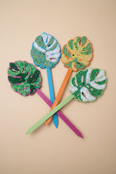 Bedazzled Monstera wooden plant stakes, hand-painted with sparkling details. Choose Monstera, Albo, Aurea or Thai Constellation for unique plant décor.
