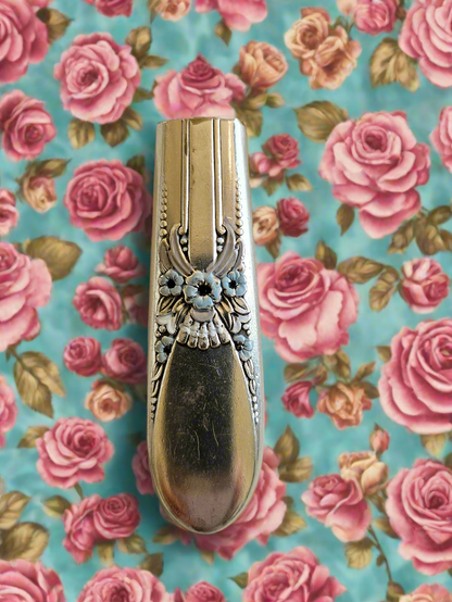 Whimsical bud vases crafted from vintage silverware with magnetic backs—perfect for single blooms and small clippings. Each one is a one-of-a-kind treasure.