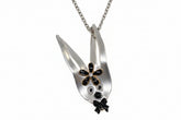 Whimsical fancy bunny pendant necklace handcrafted from vintage silverware, resin, and beads. One-of-a-kind Easter or everyday jewelry with vintage charm.