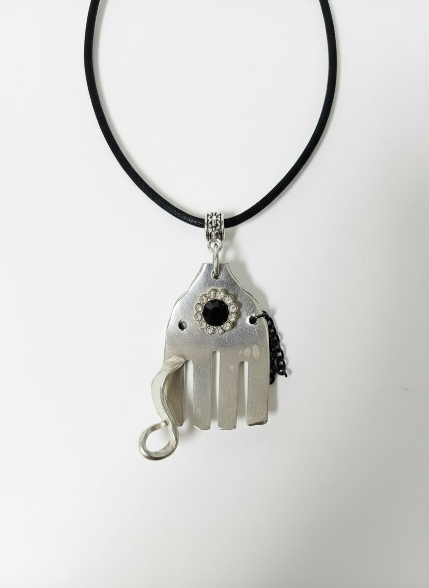 Handcrafted silver elephant pendant made from vintage silverware. Symbolizes strength, wisdom &amp; luck. Eco-friendly, one-of-a-kind, and artisan-made in the USA.