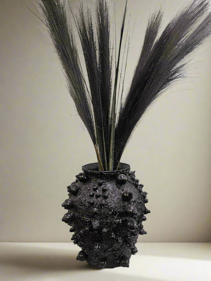 Elevate your decor with this handcrafted upcycled glass urn-shaped vase, made from reclaimed materials for a sustainable touch. Available in Glossy Black or Matte White, each unique piece offers artistic flair and eco-friendly style. Perfect for fresh or dried flowers, it suits both indoor and covered outdoor spaces.