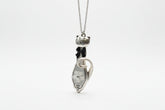 Handmade silver cat pendant necklaces from vintage silverware. Elegant, whimsical, and adjustable on a satin cord. Sustainably crafted and one-of-a-kind.