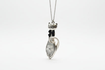 Handmade silver cat pendant necklaces from vintage silverware. Elegant, whimsical, and adjustable on a satin cord. Sustainably crafted and one-of-a-kind.