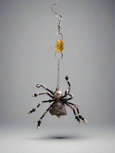 The Christmas Spider Ornament brings charm and tradition to your holiday decor. Inspired by the German legend of spiders weaving webs that Santa turned into shimmering tinsel, it symbolizes good luck and magic. Beautifully crafted, it’s a meaningful and unique addition to your tree or a thoughtful gift.