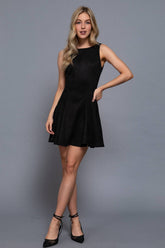 Black faux suede mini dress with a flattering fitted bodice and flared skirt. Soft stretch fabric and vintage-inspired style make it a perfect fall favorite.