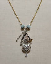 Handcrafted silver birdhouse pendant made from vintage silverware. A whimsical, one-of-a-kind necklace perfect for nature lovers and vintage jewelry fans.