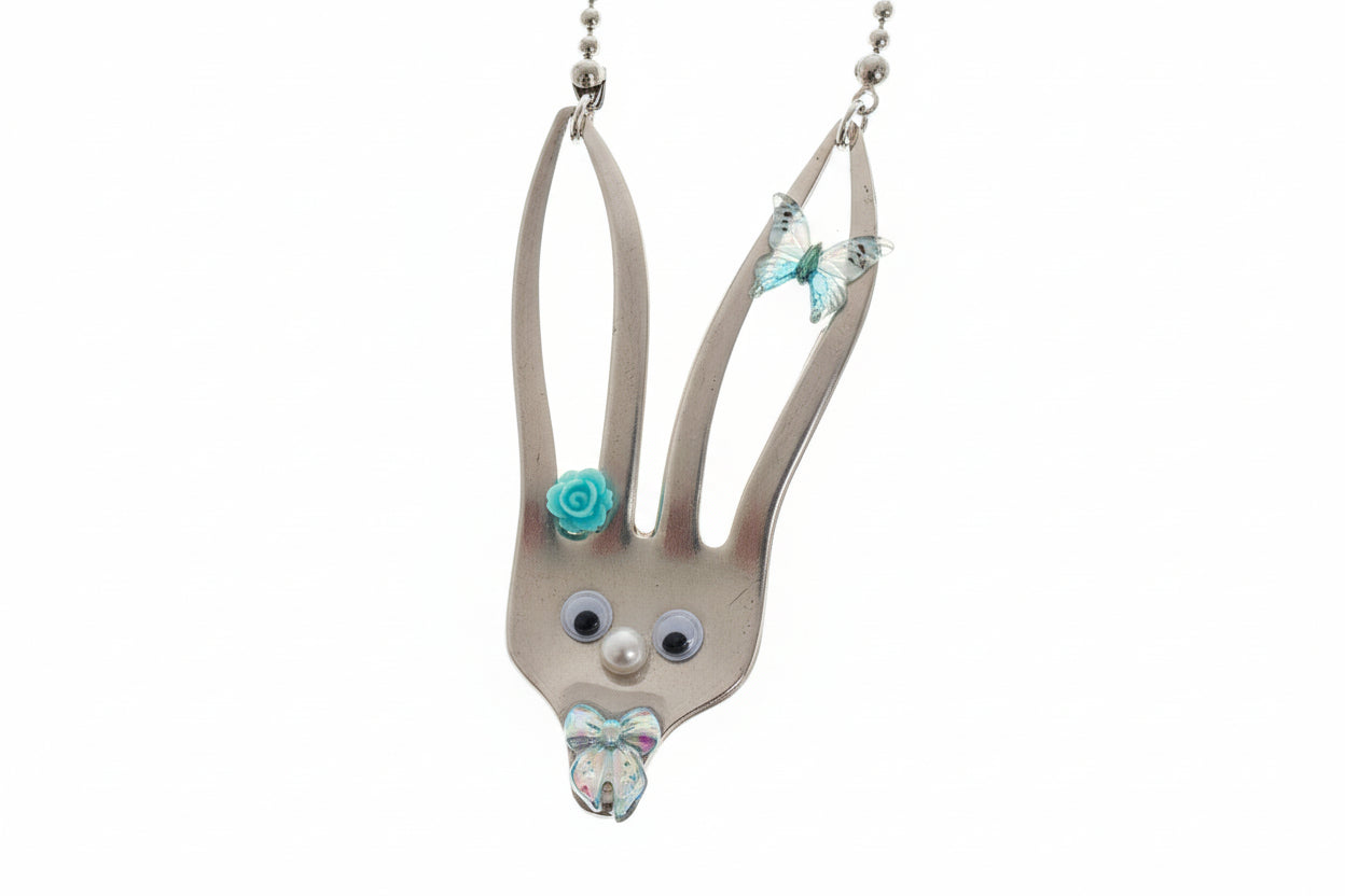 Whimsical fancy bunny pendant necklace handcrafted from vintage silverware, resin, and beads. One-of-a-kind Easter or everyday jewelry with vintage charm.