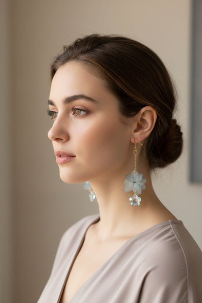 Real dried flower drop earrings preserved in resin with sparkling crystal accents. Romantic botanical jewelry with a delicate, one-of-a-kind garden feel.