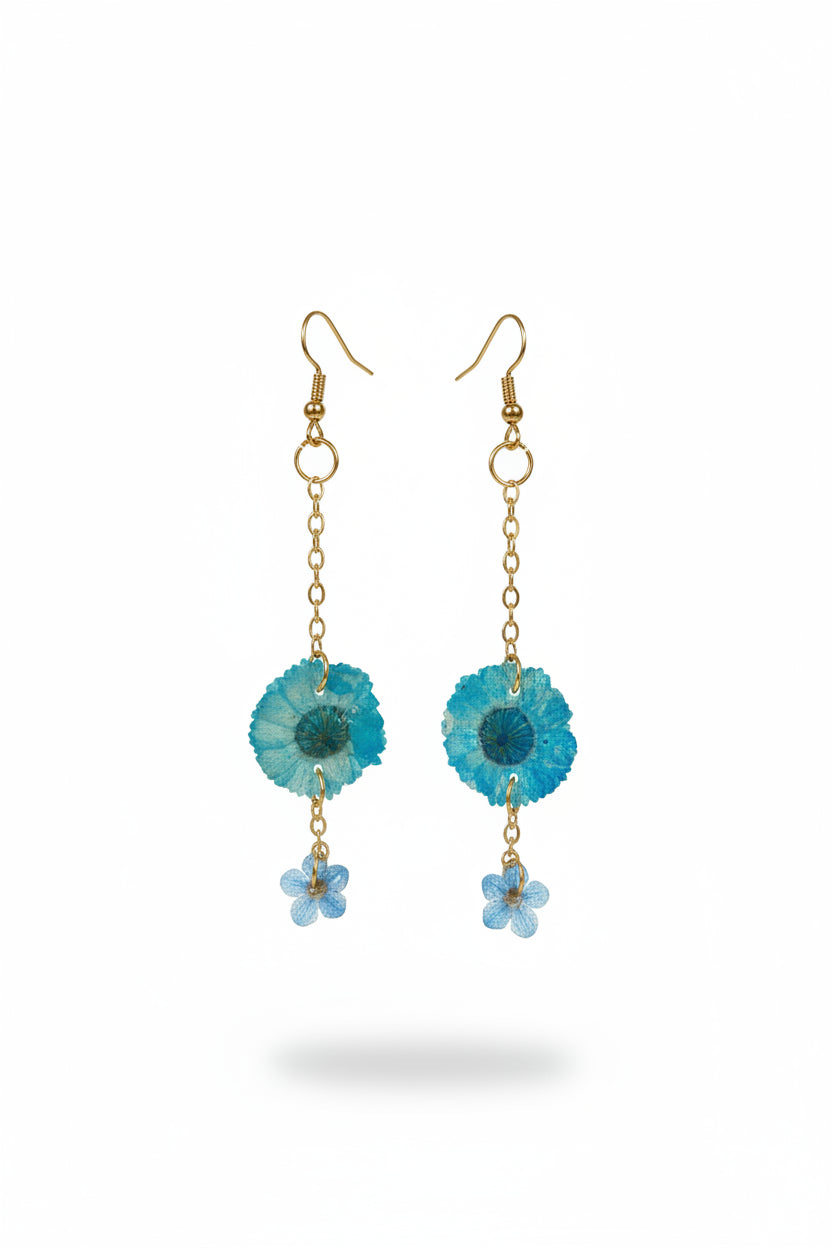 Real dried flower drop earrings preserved in resin with sparkling crystal accents. Romantic botanical jewelry with a delicate, one-of-a-kind garden feel.