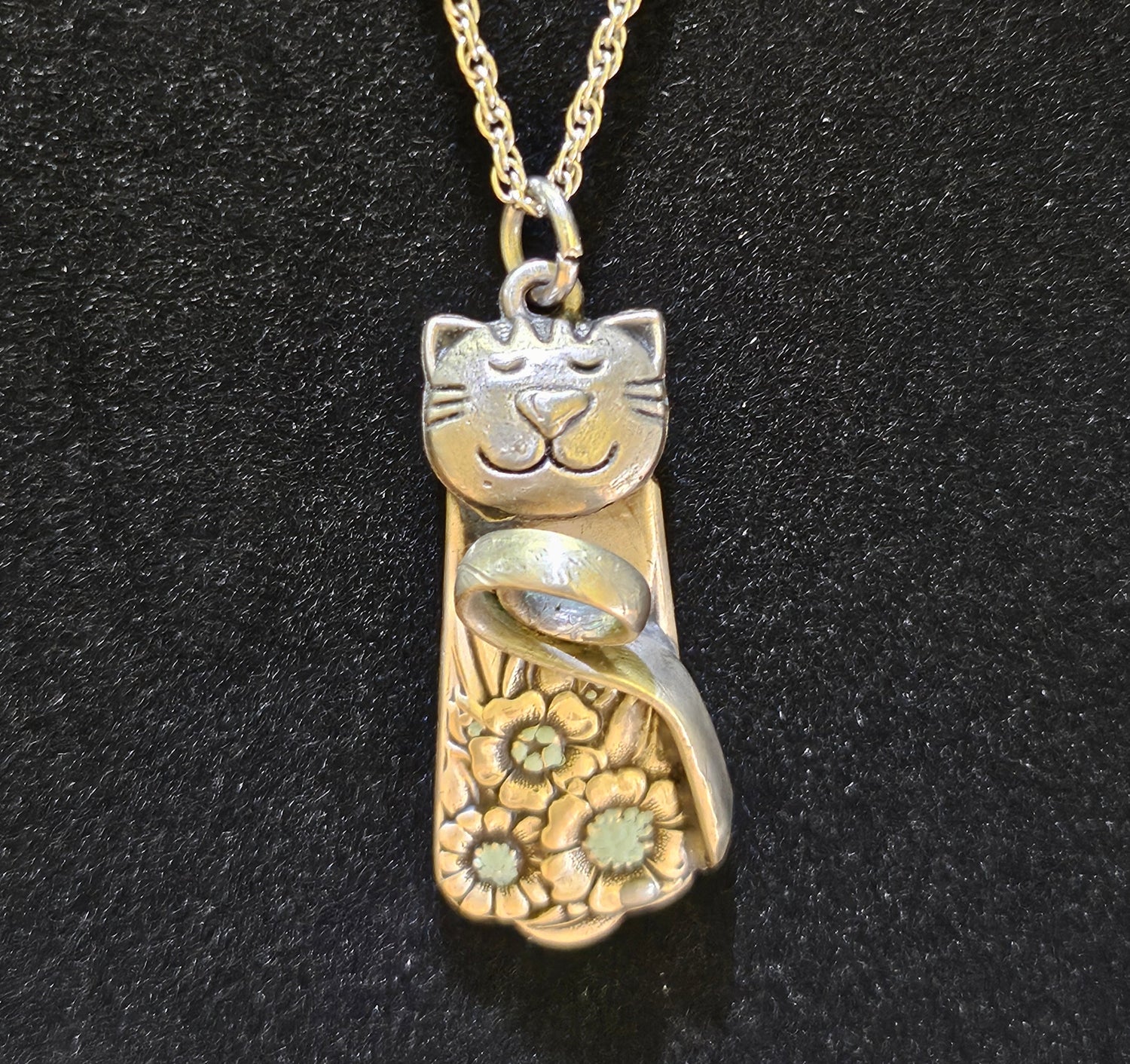 Handmade silver cat pendant necklaces from vintage silverware. Elegant, whimsical, and adjustable on a satin cord. Sustainably crafted and one-of-a-kind.