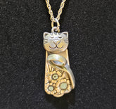 Handmade silver cat pendant necklaces from vintage silverware. Elegant, whimsical, and adjustable on a satin cord. Sustainably crafted and one-of-a-kind.