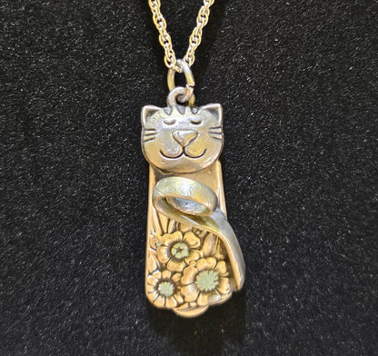 Handmade silver cat pendant necklaces from vintage silverware. Elegant, whimsical, and adjustable on a satin cord. Sustainably crafted and one-of-a-kind.