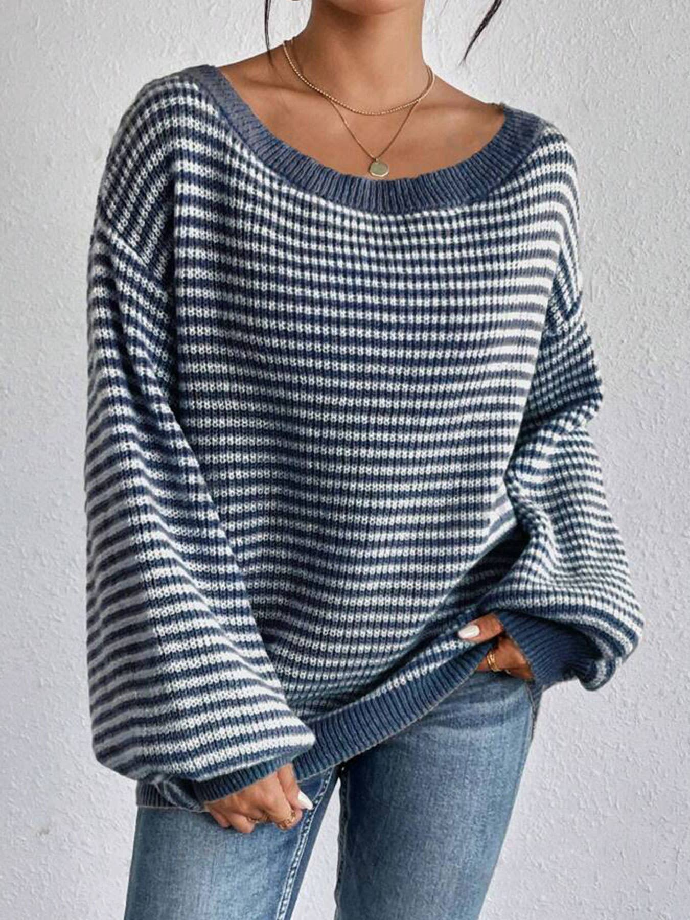 Cozy colorblocked striped one-shoulder knit sweater with relaxed fit and soft fabric. Wear off-shoulder or boat neck. Perfect for fall layering with denim or skirts.
