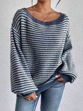 Cozy colorblocked striped one-shoulder knit sweater with relaxed fit and soft fabric. Wear off-shoulder or boat neck. Perfect for fall layering with denim or skirts.