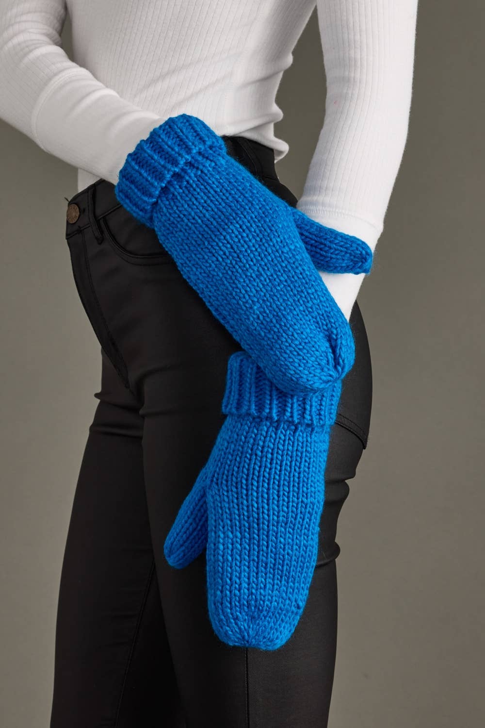 Blue cuffed knit mittens by Panache Apparel Co., made from 100% acrylic with cozy fleece lining. A classic winter accessory for chilly days and outdoor strolls.