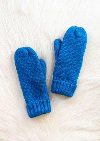 Blue cuffed knit mittens by Panache Apparel Co., made from 100% acrylic with cozy fleece lining. A classic winter accessory for chilly days and outdoor strolls.