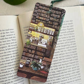 Hand-illustrated "Bookish Café Retreat" bookmark on premium textured paper. Perfect for cozy reading moments with a warm drink and your favorite book