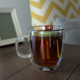Brown Heart Book Tea Steeper makes loose leaf tea easy in any mug. Reusable, dishwasher safe, eco-friendly. A charming gift for tea and book lovers.