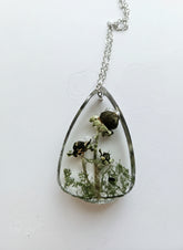 Gathered-in-the-Wild Botanical Necklace with real foraged flowers, mushrooms, pine needles, and leaves preserved in resin. Handcrafted wearable nature art by KStonely.