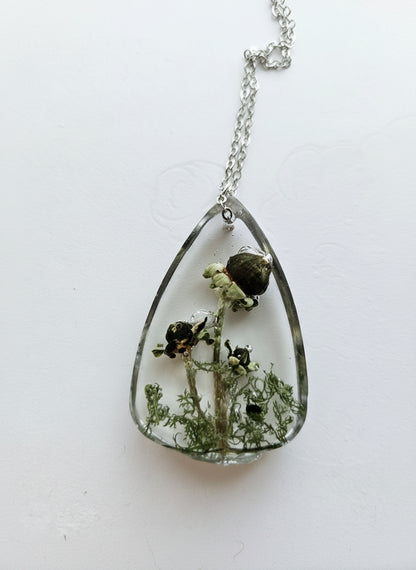 Gathered-in-the-Wild Botanical Necklace with real foraged flowers, mushrooms, pine needles, and leaves preserved in resin. Handcrafted wearable nature art by KStonely.