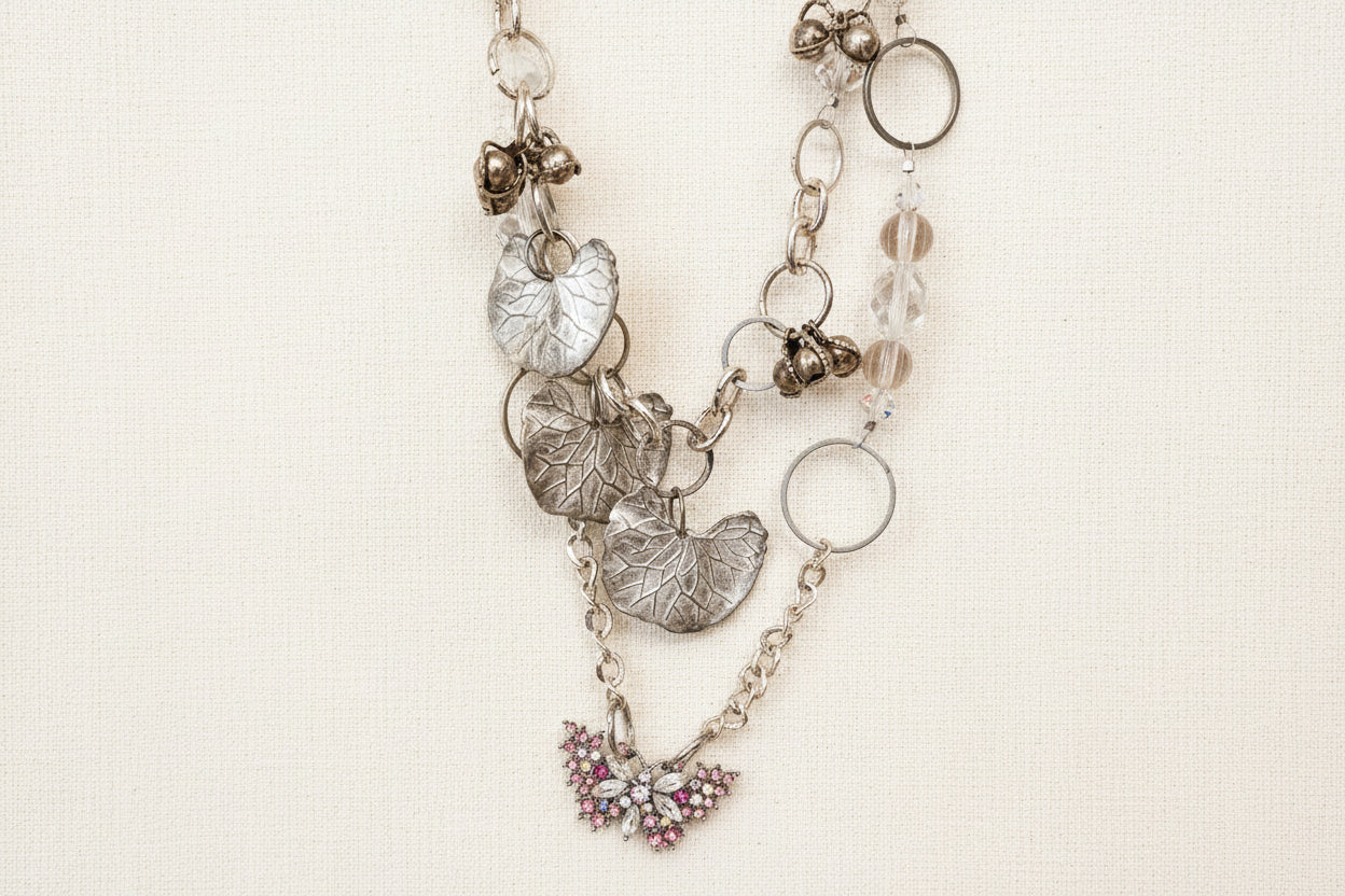 Pink Butterfly Curated Chaos Layered Charm Necklace handcrafted by artist KStonely with chains, ribbon, beads, and unique charms. One-of-a-kind mixed-media wearable art jewelry.