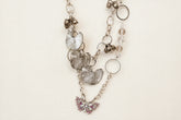 Pink Butterfly Curated Chaos Layered Charm Necklace handcrafted by artist KStonely with chains, ribbon, beads, and unique charms. One-of-a-kind mixed-media wearable art jewelry.