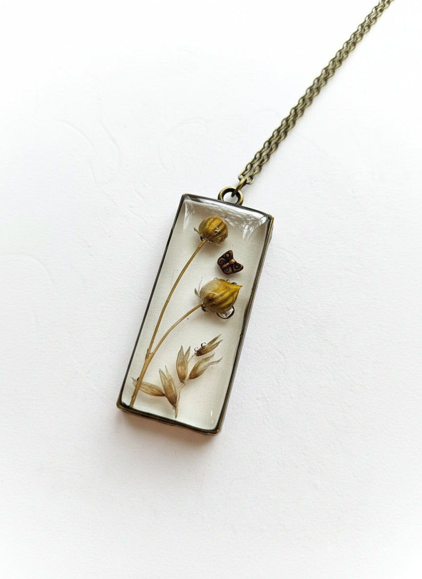 Gathered-in-the-Wild Botanical Necklace with real foraged flowers, mushrooms, pine needles, and leaves preserved in resin. Handcrafted wearable nature art by KStonely.