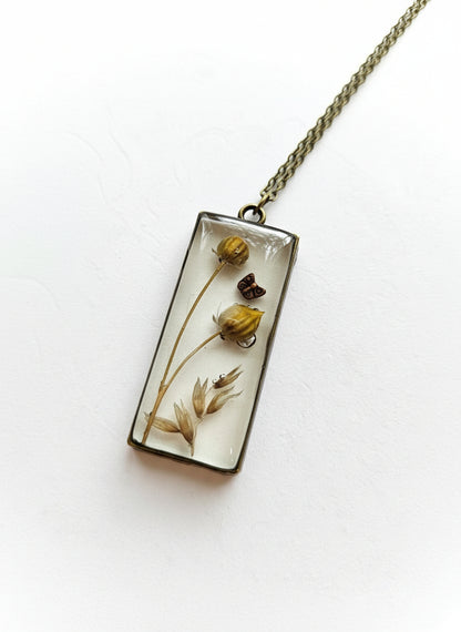 Gathered-in-the-Wild Botanical Necklace with real foraged flowers, mushrooms, pine needles, and leaves preserved in resin. Handcrafted wearable nature art by KStonely.