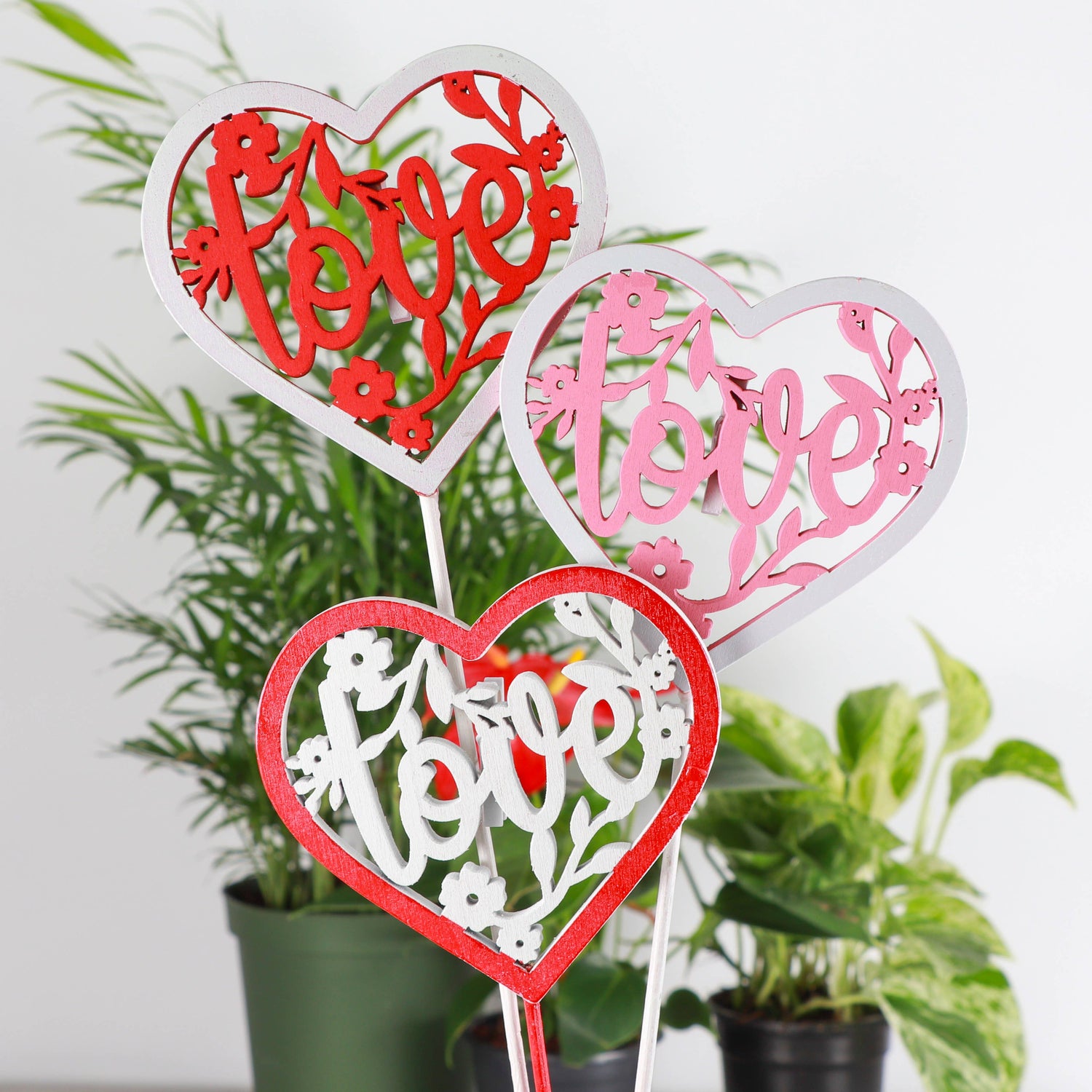 Wooden heart plant picks with built-in clip for cards or notes. Perfect finishing touch for houseplant gifts. Trim-to-fit 18" stake. No plants 
