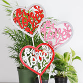 Wooden heart plant picks with built-in clip for cards or notes. Perfect finishing touch for houseplant gifts. Trim-to-fit 18" stake. No plants 