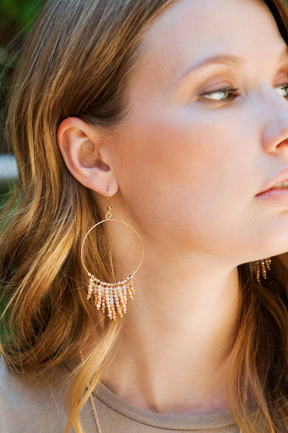 Shimmering beaded tassel chandelier earrings with a lightweight metal ring, hypoallergenic fish hooks, and dazzling glass beads—perfect for any occasion! 
