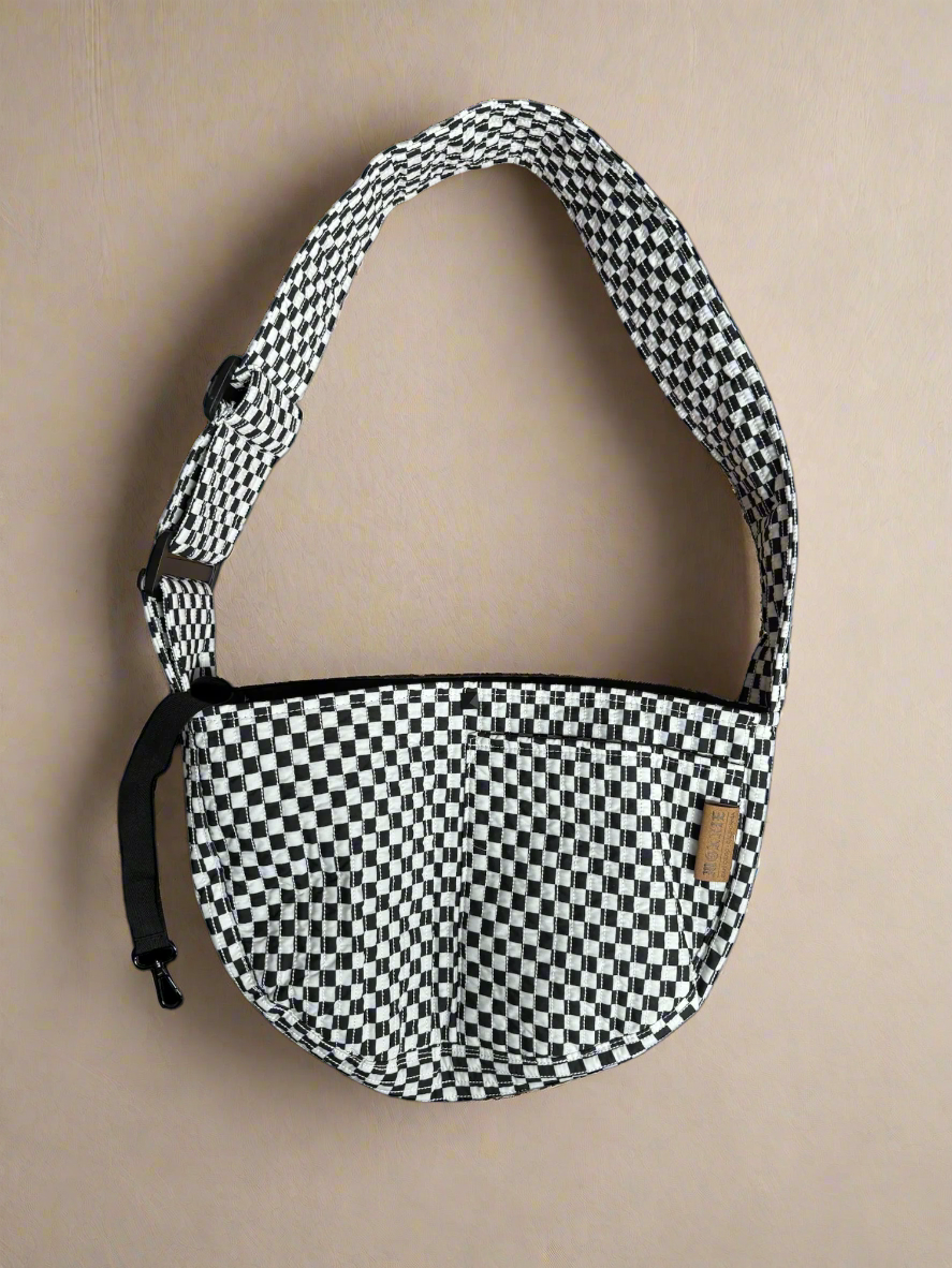 Pet Crossbody Sling and Carrier keeps you hands free while your pet stays secure. Adjustable strap, cozy design and safety clip for everyday adventures.