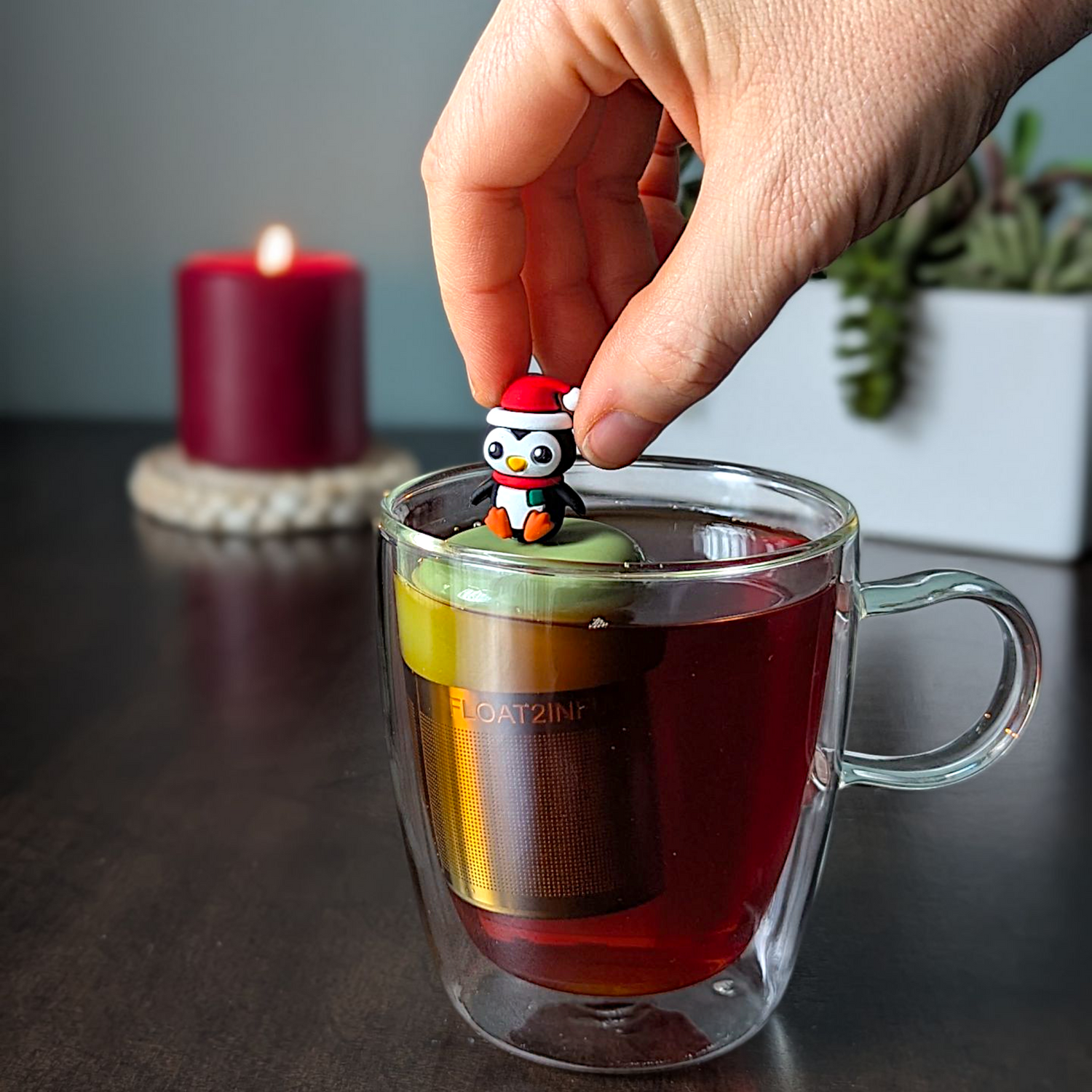Christmas Penguin Tea Steeper with silicone cap and fine mesh. Perfect for hot or iced tea, reusable, giftable, and designed with heart.