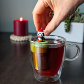 Christmas Penguin Tea Steeper with silicone cap and fine mesh. Perfect for hot or iced tea, reusable, giftable, and designed with heart.