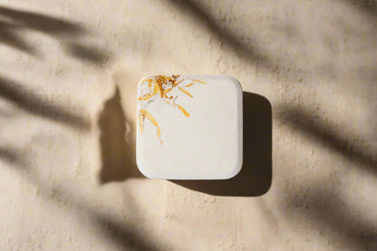 2oz handmade botanical bath bomb. Biodegradable wrap, rich oils, fizzy soak. Skin-softening, aromatic, and perfect for gifting or daily self-care rituals.