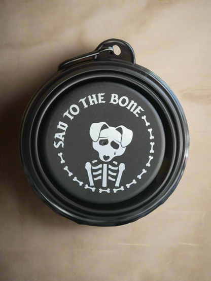 Collapsible Pet Bowl – 5&quot; silicone travel dog bowl with carabiner. Black with white “Sad to the Bone” graphic. Portable, lightweight &amp; perfect for pets.