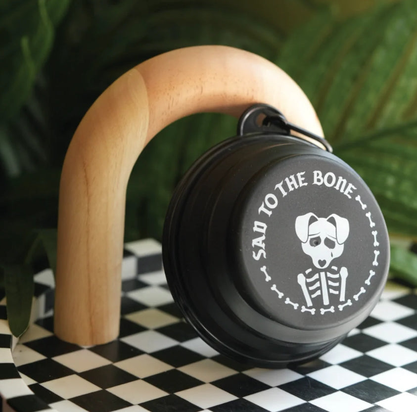 Collapsible Pet Bowl – 5&quot; silicone travel dog bowl with carabiner. Black with white “Sad to the Bone” graphic. Portable, lightweight &amp; perfect for pets.