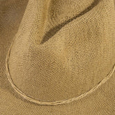 Braided cord band cowboy hat featuring woven paper straw texture and soft curved brim. Lightweight boho western style perfect for beach days, festivals, and summer outfits.