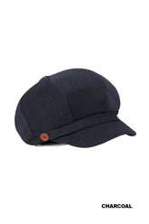 Add vintage charm with our Corduroy Cabbie Hat, featuring a curved brim, button accent, and elastic stretch back. Available in seven versatile colors.