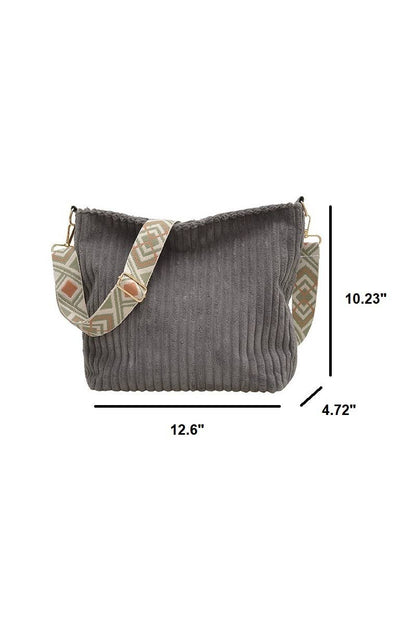 Corduroy Tote Bag with adjustable guitar strap, zipper closure and roomy design. A soft, stylish everyday shoulder bag for work, travel or nights out.