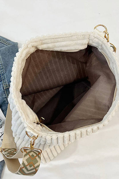 Corduroy Tote Bag with adjustable guitar strap, zipper closure and roomy design. A soft, stylish everyday shoulder bag for work, travel or nights out.