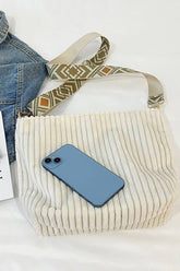 Corduroy Tote Bag with adjustable guitar strap, zipper closure and roomy design. A soft, stylish everyday shoulder bag for work, travel or nights out.