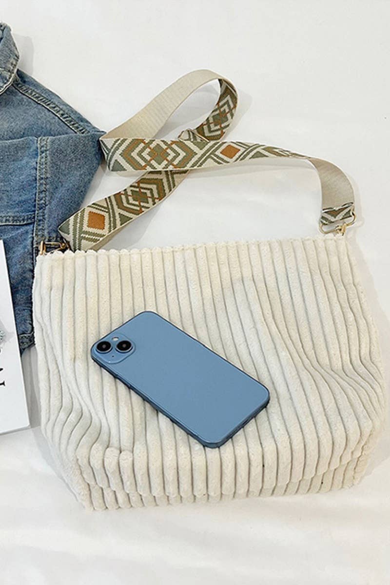 Corduroy Tote Bag with adjustable guitar strap, zipper closure and roomy design. A soft, stylish everyday shoulder bag for work, travel or nights out.