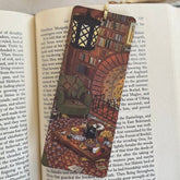 Hand-illustrated "Cozy Hobbit Nook" bookmark on premium textured paper. A perfect literary escape for fantasy lovers and cozy reading moments