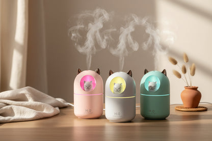 Cute cat mini humidifier with cool mist and soft night light. Quiet 300ml USB humidifier for bedrooms, desks, and nurseries. Auto shut-off.